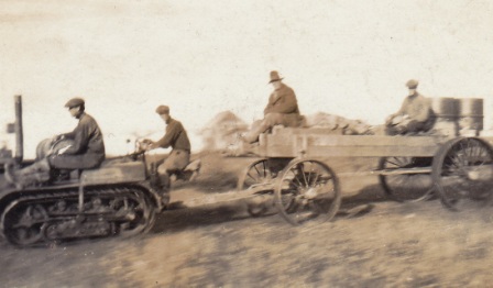 Graphite en route to Imuruk Basin during a test haul, circa 1917; Nick Tweet is seated on the wagon, the others are not identified.  Photo from the Tweet family collection.